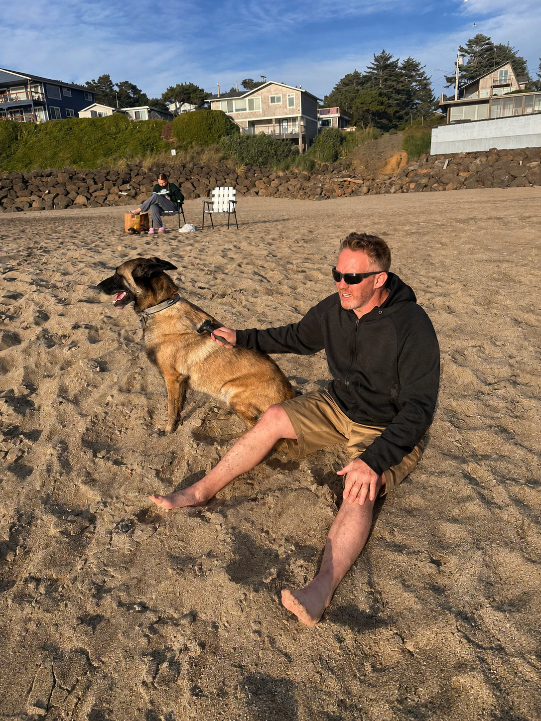 Ryan Liddicoat, owner of Barean Hilu LLC, relaxing with his Belgian Malinois after serving homeowners throughout the Tri-Cities, Washington area.